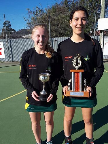 Vice Captain Cassie Calvert and Captain Breanna Tinomana holding trophies as winners of North Canterbury Netball Premier Competition.