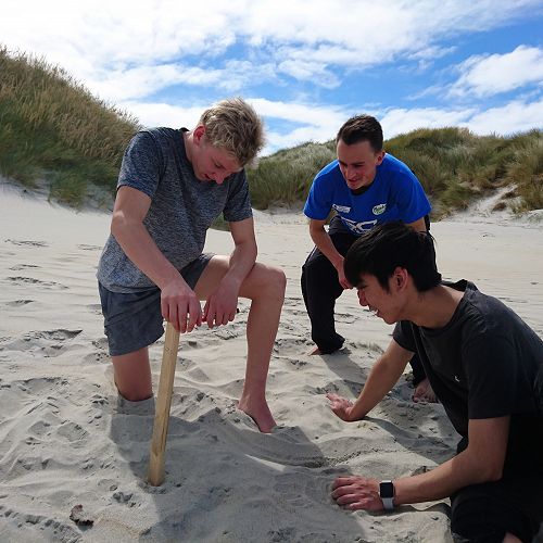 Olie, Harrison and Timmy attempt to measure saltation (sand movement due to wind action) at Sandfly Bay
