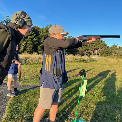 Lachie with coach Nec at trapshooting.