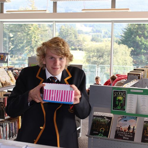 Head Librarian Liam Miller handing out the treats.