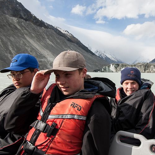 Jin Kim, Jack Grey and Angus Frew with the Tasman Glacier in view behind.&nbsp;