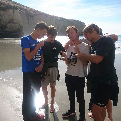 Harrison Jolly, Luckas Dickison, Stewart Ashton and Nico Bowering feign consideration of their longshore drift results at Tunnel Beach