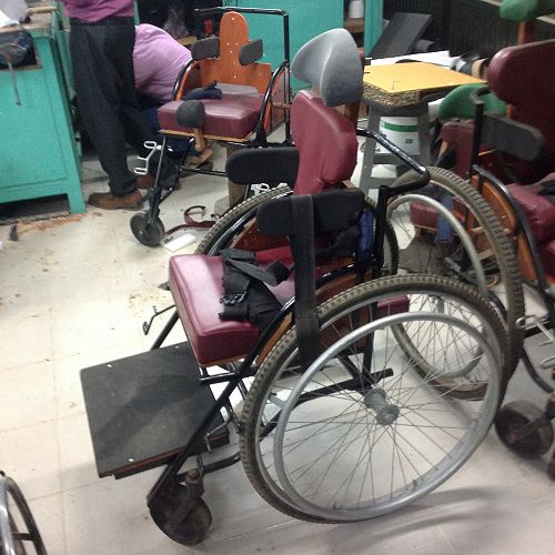 Wheelchairs are custom built in the hospital for cerebral palsy patients.