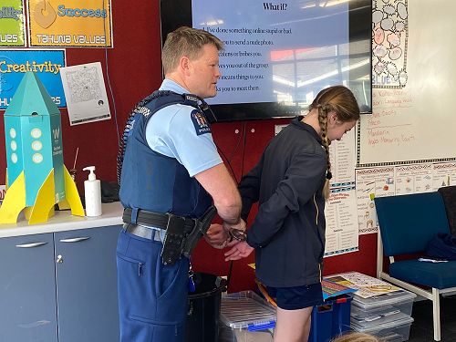 Constable Bevin simulating an arrest.