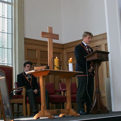 Head Boy, Henry Bell reads the lesson.