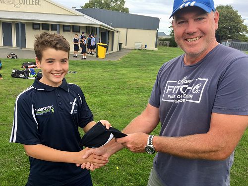 Lewis receiving his Tahuna cap from Board Rep, Brendan Murray