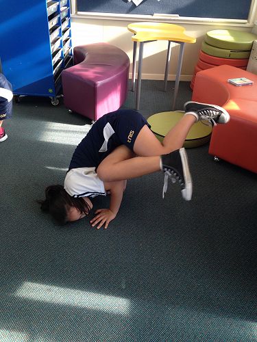 Payge Rakete-Gray Room 12 practicing a hip hop freeze