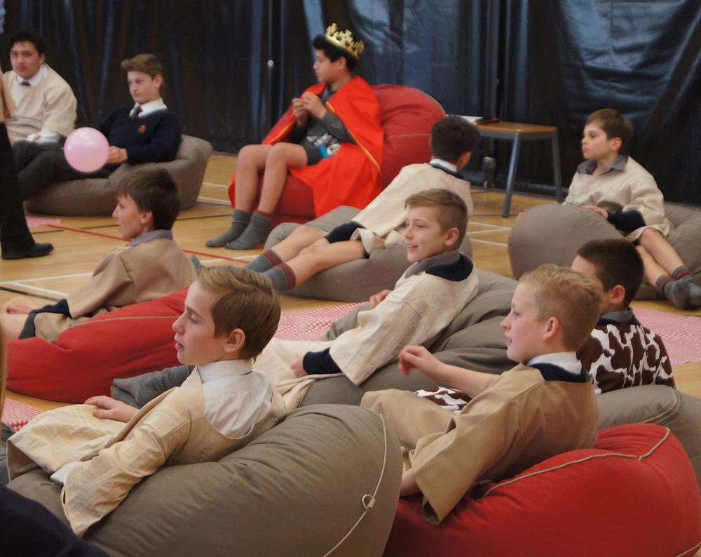 The actors watch the action