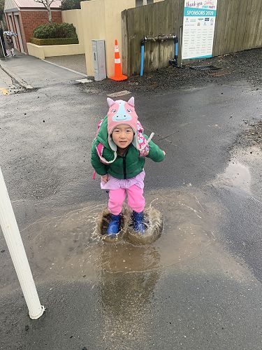 Amber loved jumping in the puddles on her way to school.