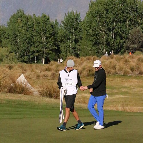 Callum White caddying in the NZ Golf Open