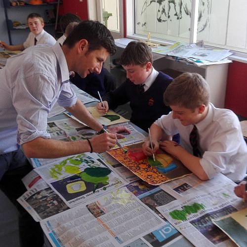 Mr Clark helps with Year 10 painting
