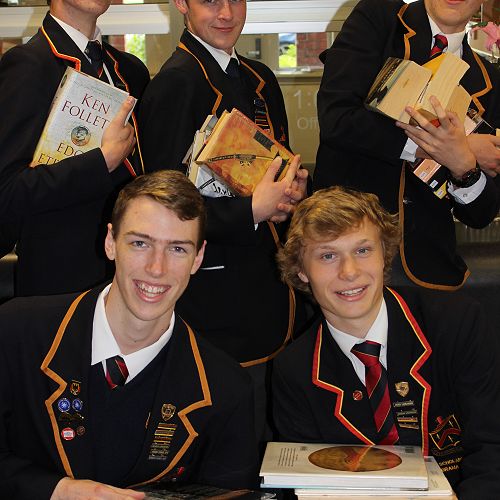 Senior Librarians help shelve some of the 2390 books which were returned after the College's Summer Reading Programme.&nbsp;