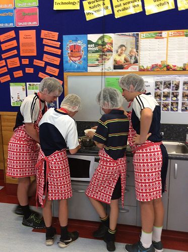 The boys making sure they follow the instruction manual carefully