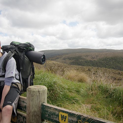 Aidan Dougherty takes a break during the second day of the overnight tramp.