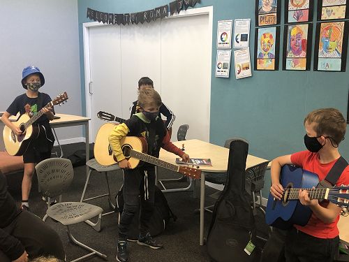 Guitar boys showing us what they have learned after their practice, awesome! 