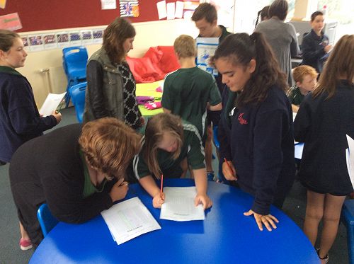 Ivy fills out her data form when interviewing Hope.