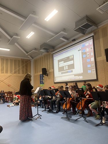 Mrs Kumar conducts the orchestra