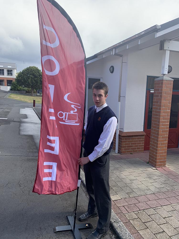 Jacob Struthers (Year 12) setting up the 'open for business' espresso flag.