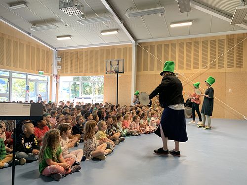 Mrs Kumar leads an Irish themed singing assembly