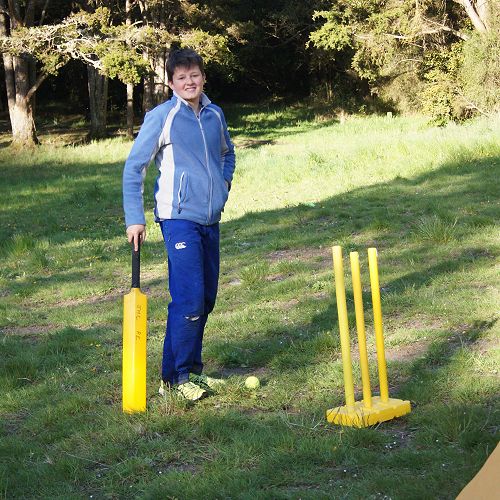 Relaxing at the campsite - Thomas prepares to play cricket with Mr Allen (student teacher)