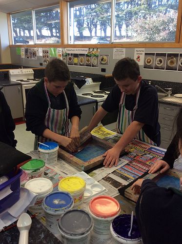 Careful concentration required at the screen printing table.