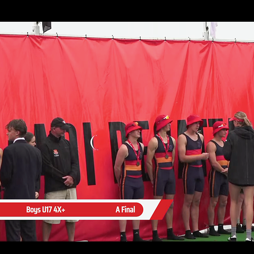 U17 Quad receiving their medals with their two happy coaches
