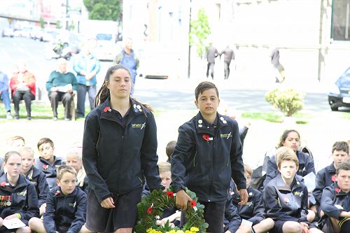 Presenting a wreath to the cenotaph.