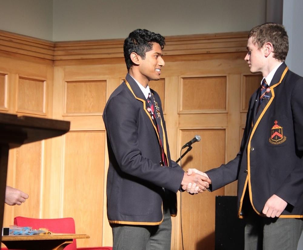 Darcy Neville receiving his Level 1 Excellence Endorsement Badge from head boy, Krishan Luxmanan.