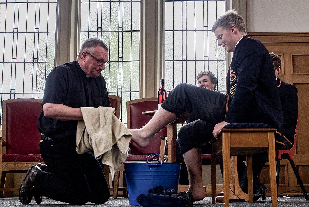 Easter 2017; Rev washes Charlie Baker's feet.