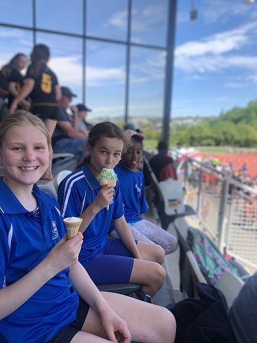 Holly, Mia and Makanaka enjoy an icecream in the sun