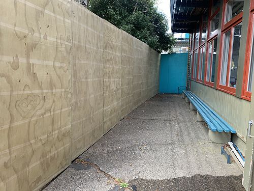 The hoarding outside Room 4 and 6A blocking off access to the front field