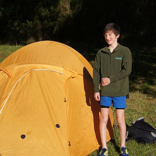Zack stands beside his group's tent as 9GAV finally get to see the Sun