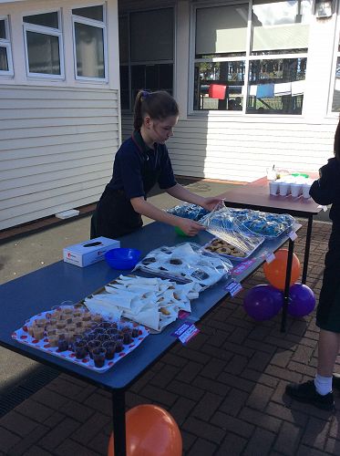 Ruby setting up the tables before the crowds arrive!