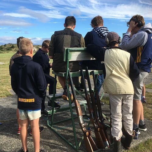 John McGlashan College students gather round to assess the scores of their first shoot of the season