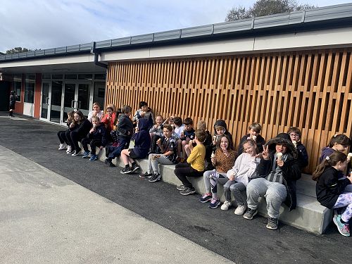 Rūma tekau celebrating the opening of the new school with ice cream 