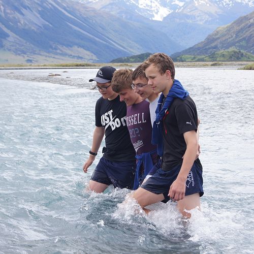 Danny, Alex, Nathan and Ben practising their river crossing technique