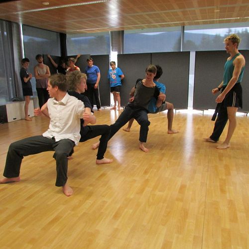 RNZB dancer Loughlan Prior watches over the senior drama students as they try the counterbalance exercises