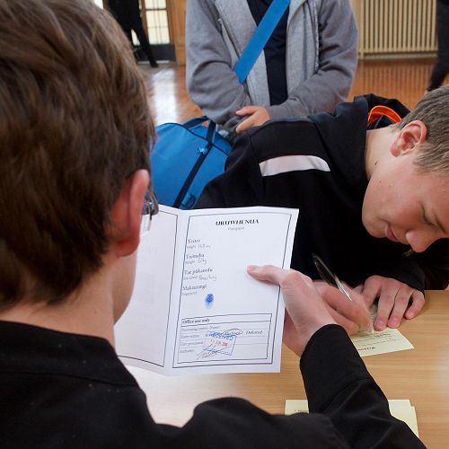 Ben complies with 'entry testing' as his 'passport' is examined