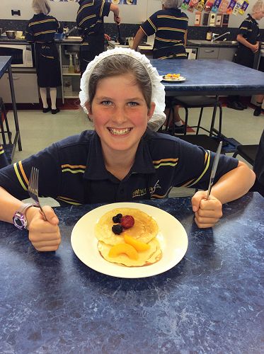 Georgia is delighted with how well she cooked her pancakes