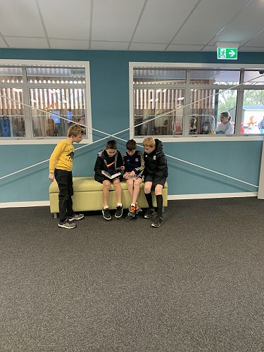 Joseph, Jaxion, Victor, and Makkai get comfortable in the learning street