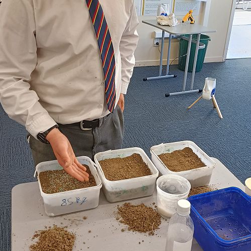 Mackenzie Sheppard planting ryegrass.
