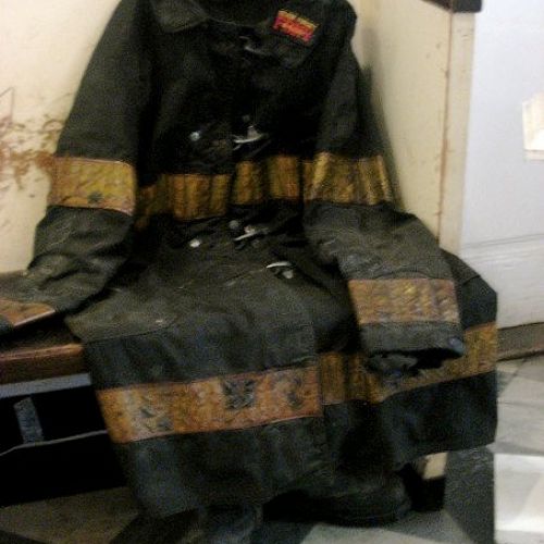 A fire fighter's gear from 9/11 - still with the dust from the fallen towers on it. A frozen moment in time.