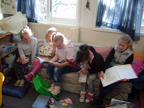The couch in Room 8 is a great place to share stories with Room 3 buddies.