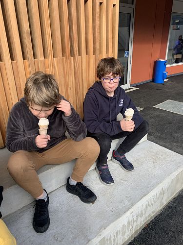 Sam and Adam enjoy their ice cream 