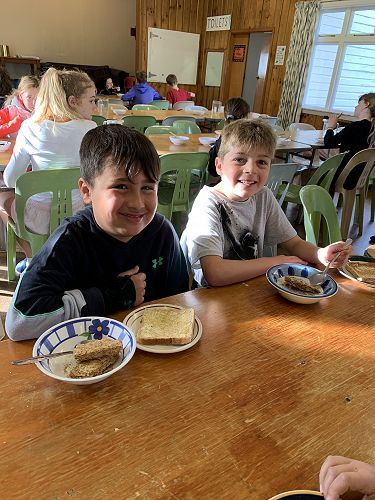 Tiaki and Rhys enjoy their breakfast