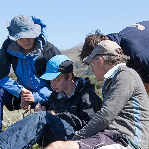 Ben Hall, Lachlan Kenneally are assisted with river flow calculations by Mr Geoff Murdoch.