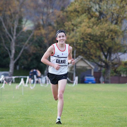 Oliver Chignell comes down the final straight to win the Senior cross country