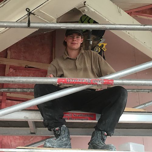 Zach White sits proudly on top of the&nbsp;scaffolding at his Gateway placement&nbsp;