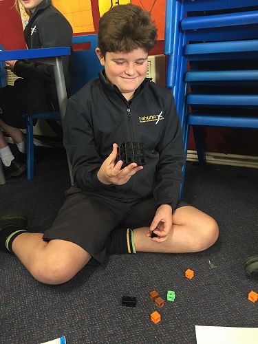 Jeremy proudly displays his cuboid.