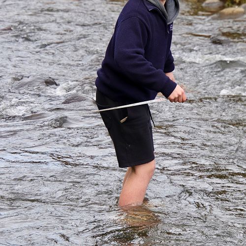 George Connor braves the not overly warm waters of Leith as only a Stewart Island man can, barefoot.